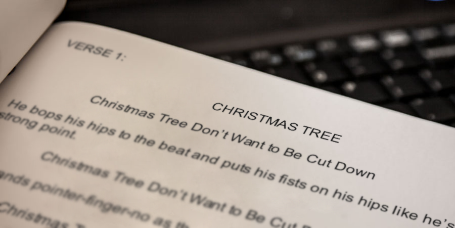 A copy of The Hunt for the Holiday Spirit pilot script lays on a keyboard.