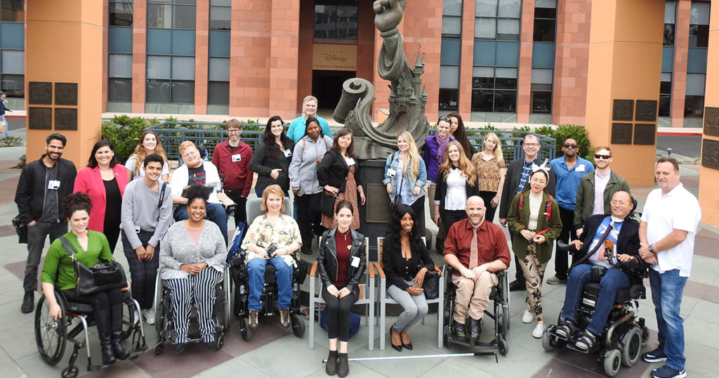 Diverse group of summer lab participants with disabilities posing for photo on Walt Disney lot.